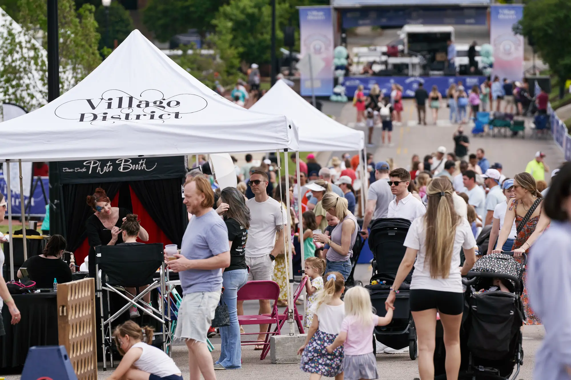 the crowd and vendors at Village District 75th Anniversary Celebration