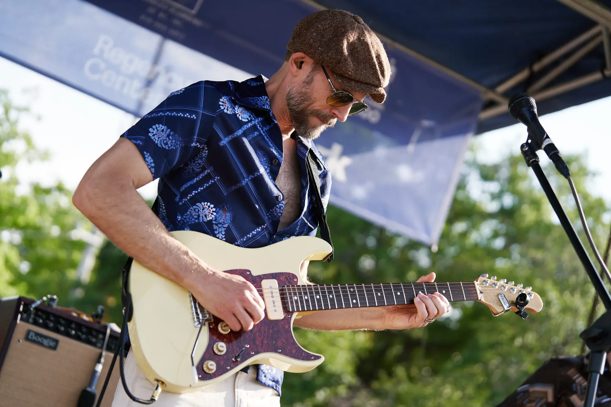 Man playing guitar at Village District 75th Anniversary Celebration
