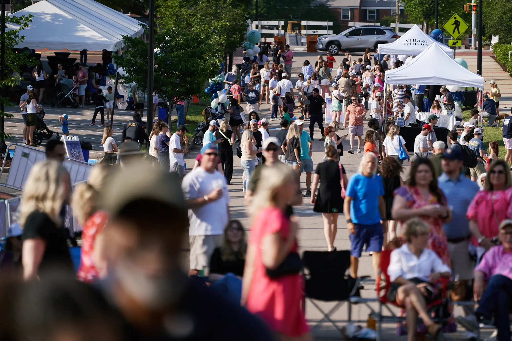 crowds and vendors at Village District 75th Anniversary Celebration