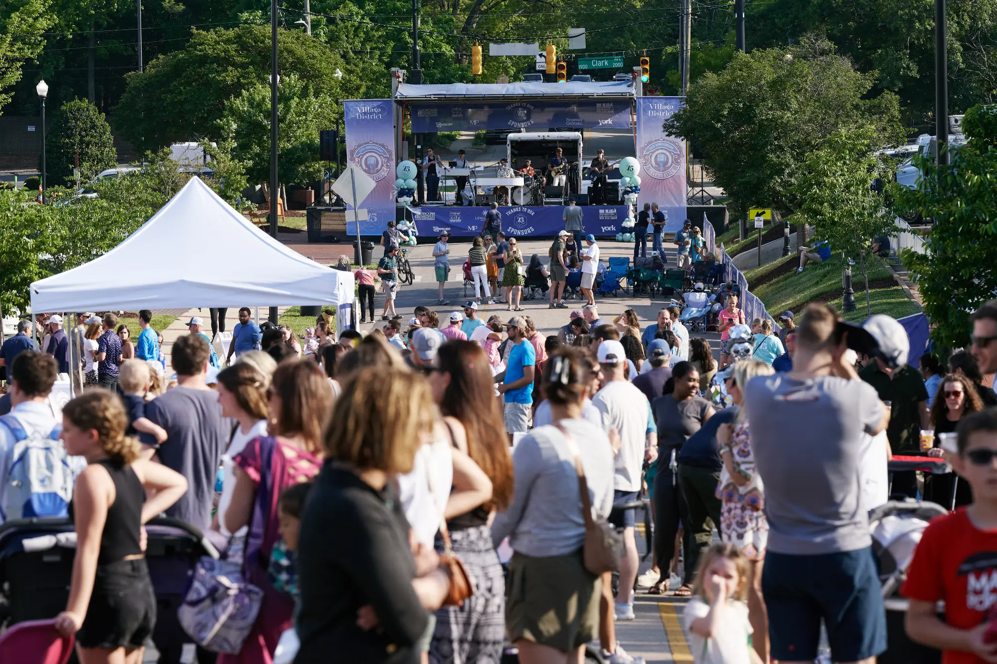 crowds and the stage at Village District 75th Anniversary Celebration