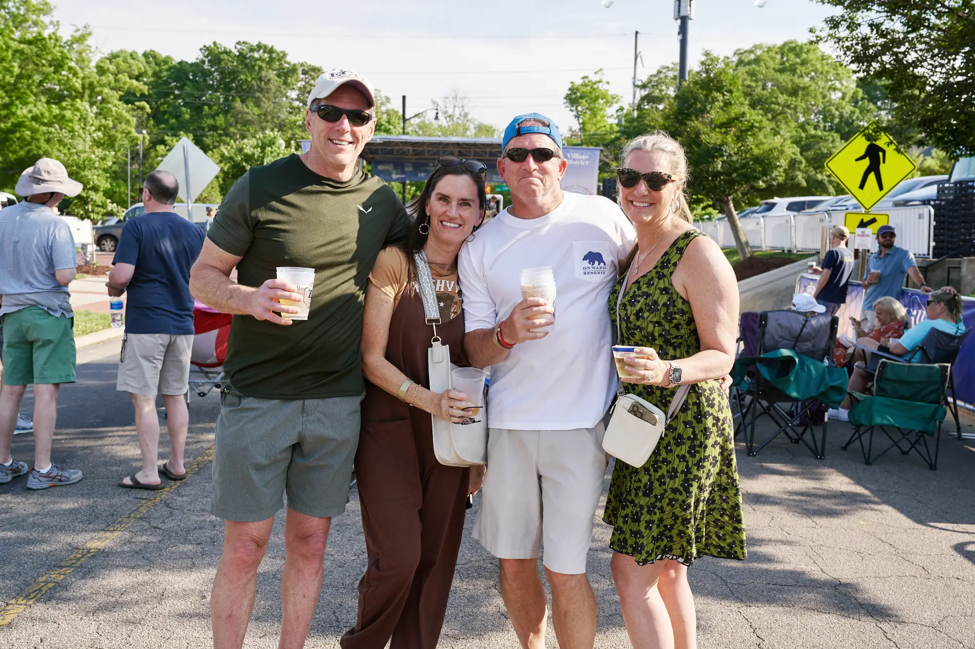 two couples smiling at the camera