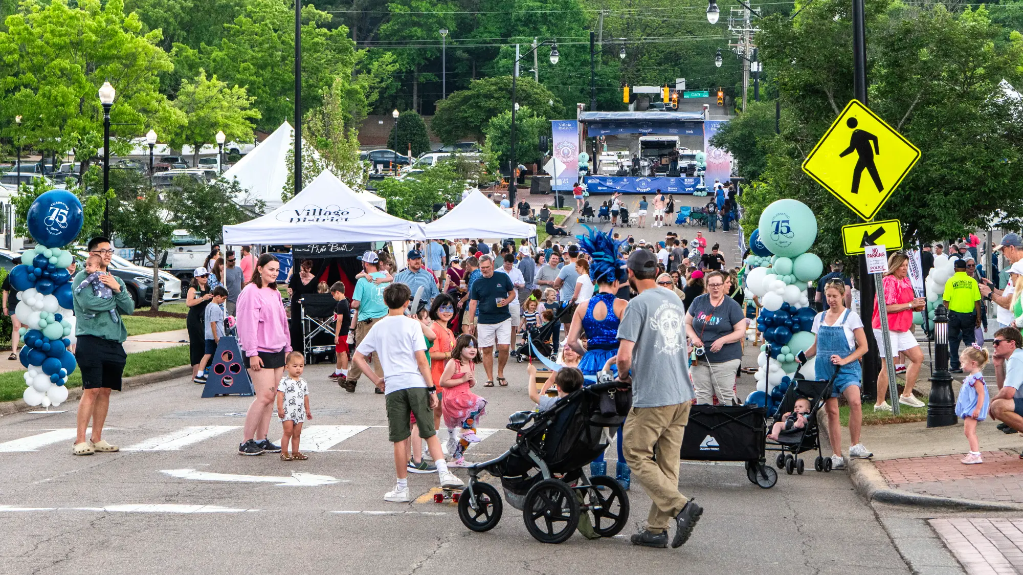 crowds and vendors at Village District 75th Anniversary Celebration