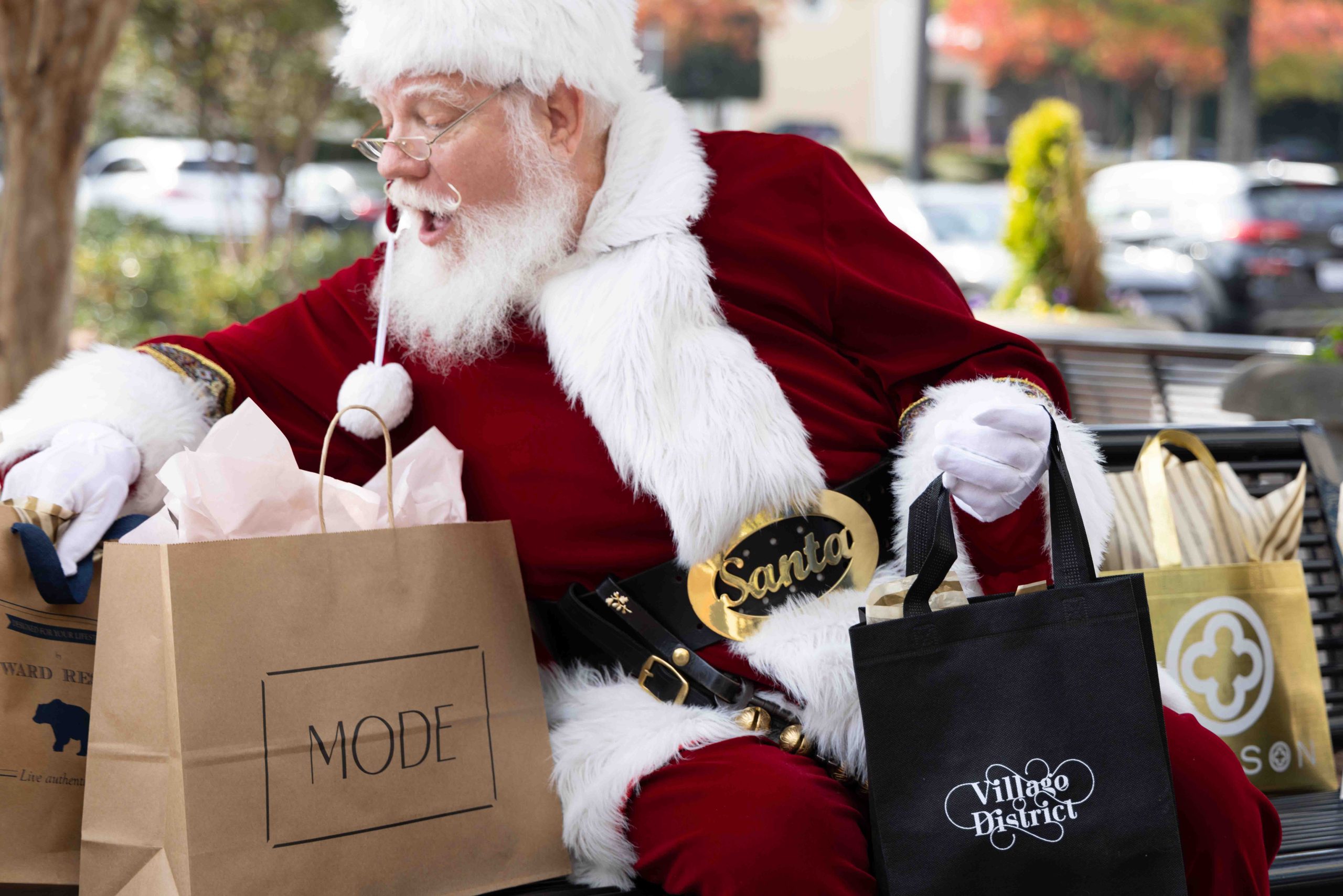 Santa with Mode and Village District shopping bags